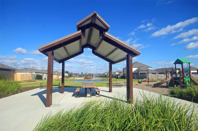 a view of a patio with a table and chairs