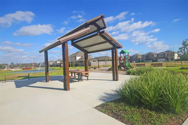 a view of a house with swimming pool and a yard