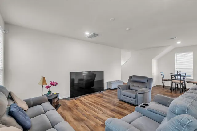 a living room with furniture or couch and a flat screen tv
