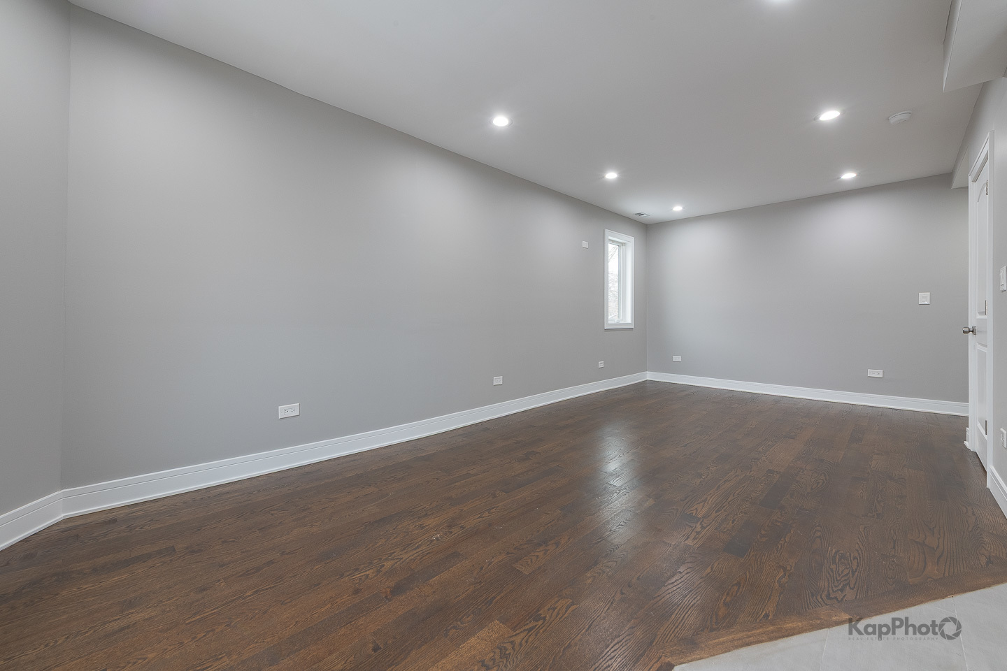 3044 West Irving Park Road, Unit 2 Chicago, IL 60618 - Photo 9 of 27 an empty room with wooden floor and windows