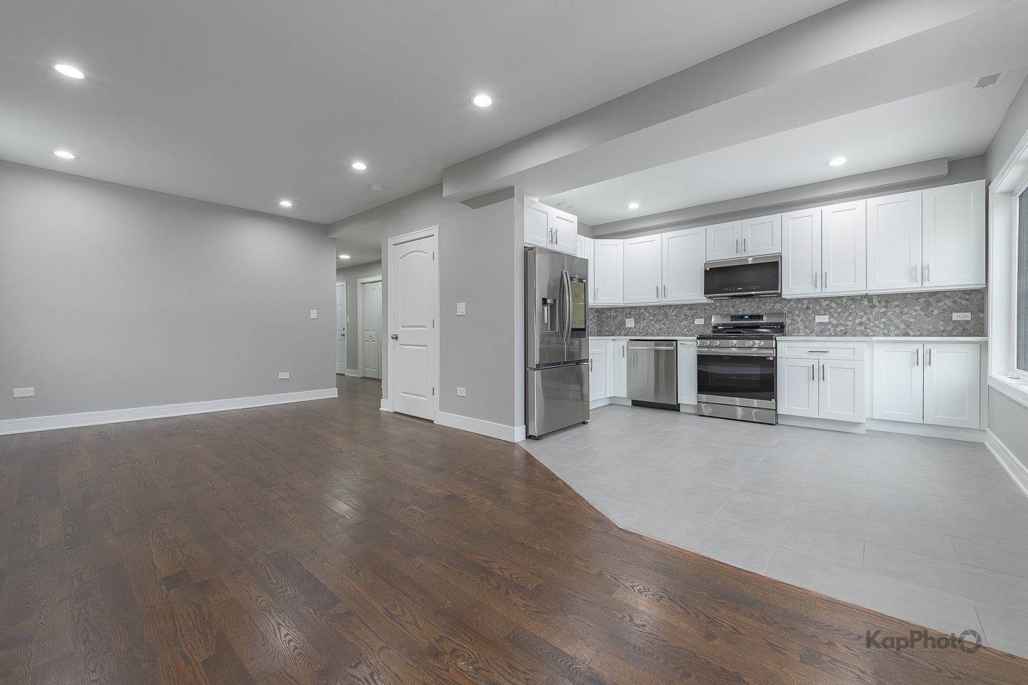 3044 West Irving Park Road, Unit 2 Chicago, IL 60618 - Photo 10 of 27 a view of a kitchen with a sink and a stove top oven