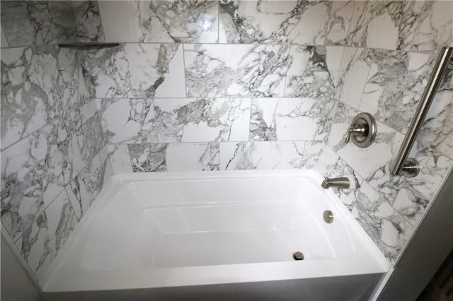 a bath tub sitting in a bathroom