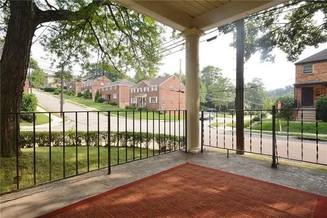 a view of a street from a balcony