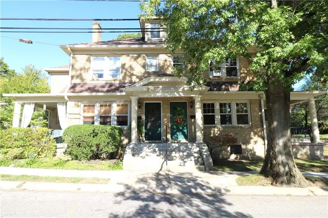 a view of a house with outdoor seating
