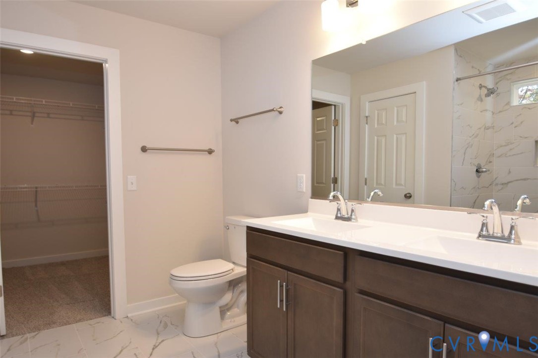 375 Amick Road Louisa, VA 23093 - Photo 23 of 25 a bathroom with a sink a toilet and a mirror