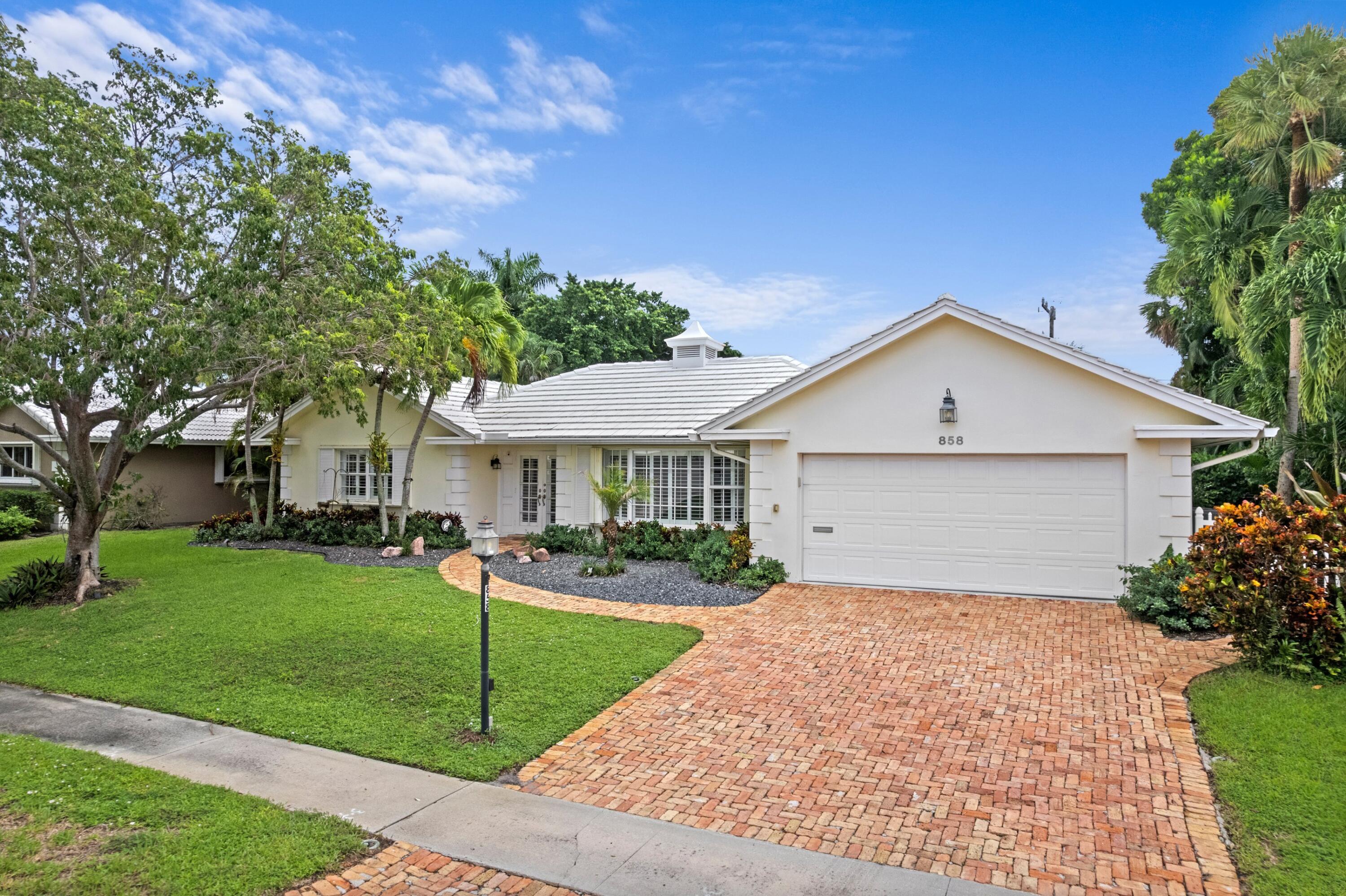 858 Hickory Terrace Boca Raton, FL 33486 - Photo 1 of 43 a front view of house with yard and green space