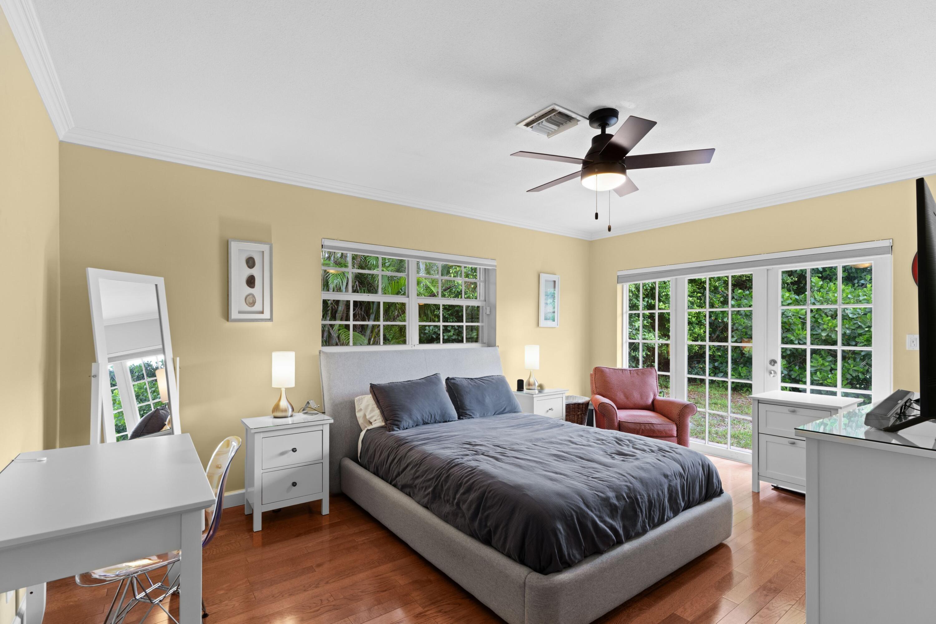 858 Hickory Terrace Boca Raton, FL 33486 - Photo 11 of 43 a spacious bedroom with a bed and a large window