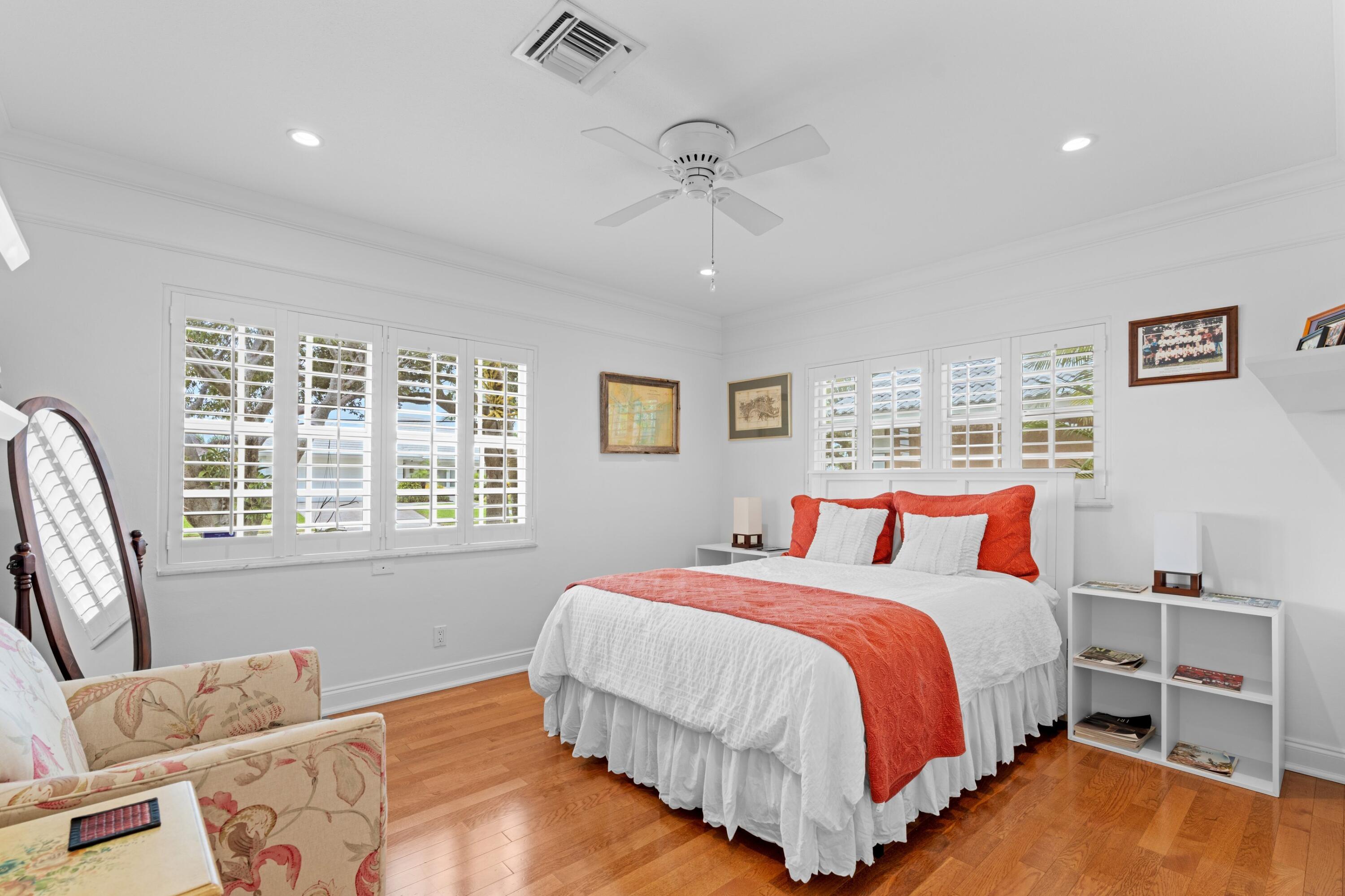 858 Hickory Terrace Boca Raton, FL 33486 - Photo 14 of 43 a bedroom with a bed and wooden floor