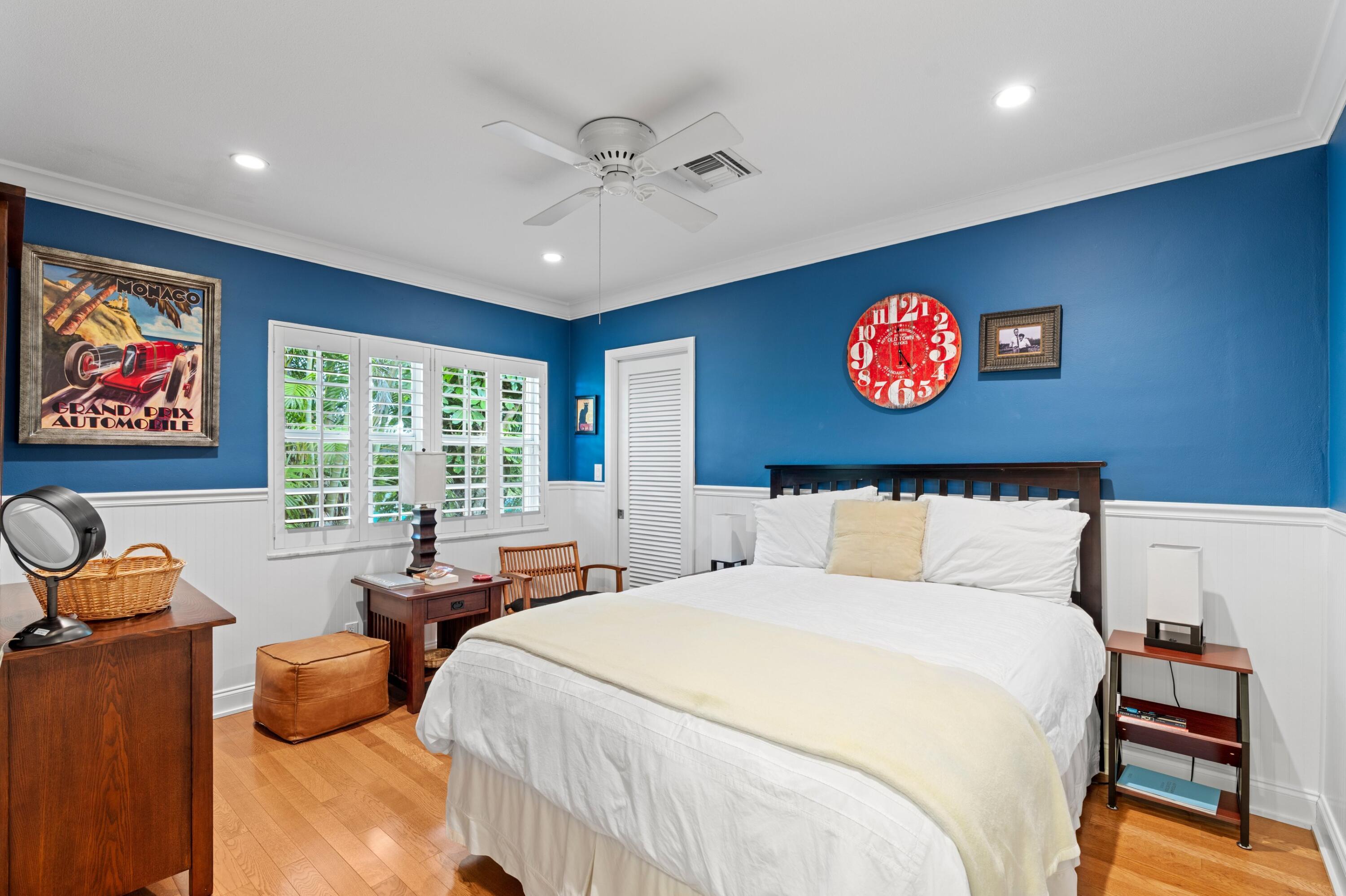 858 Hickory Terrace Boca Raton, FL 33486 - Photo 16 of 43 a bed room with furniture and a large window