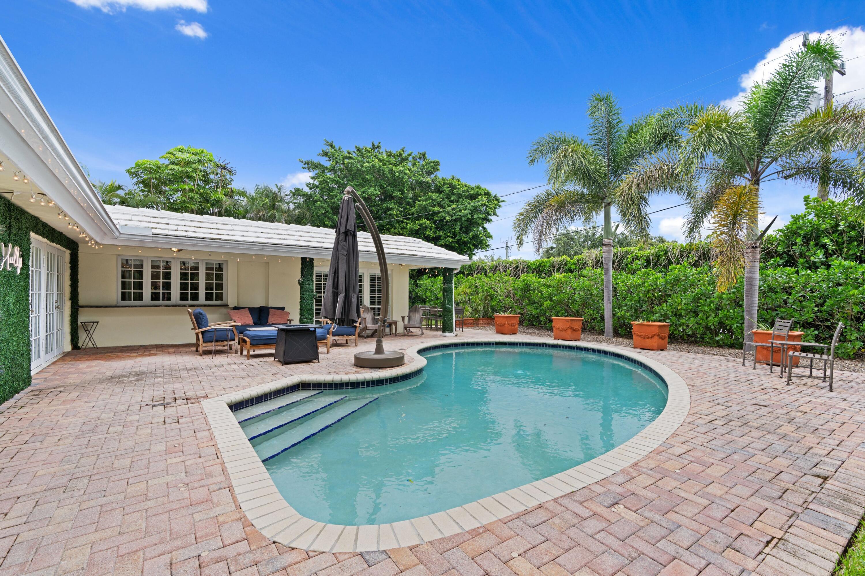 858 Hickory Terrace Boca Raton, FL 33486 - Photo 20 of 43 a view of a swimming pool with lounge chair