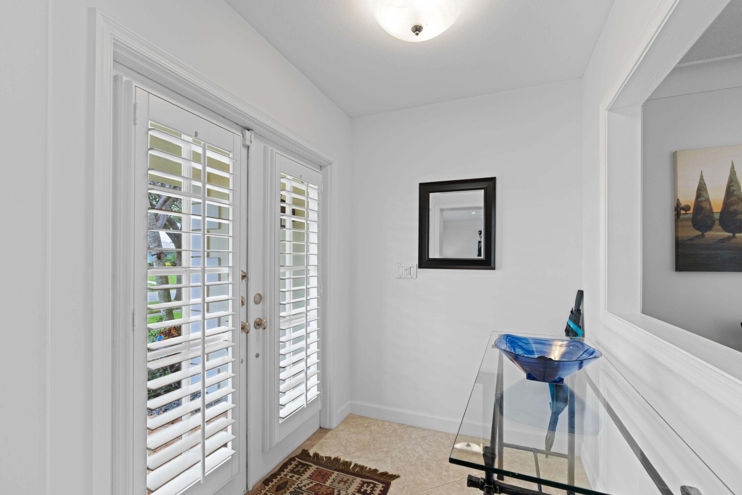 858 Hickory Terrace Boca Raton, FL 33486 - Photo 24 of 43 a view of a room with furniture and a window