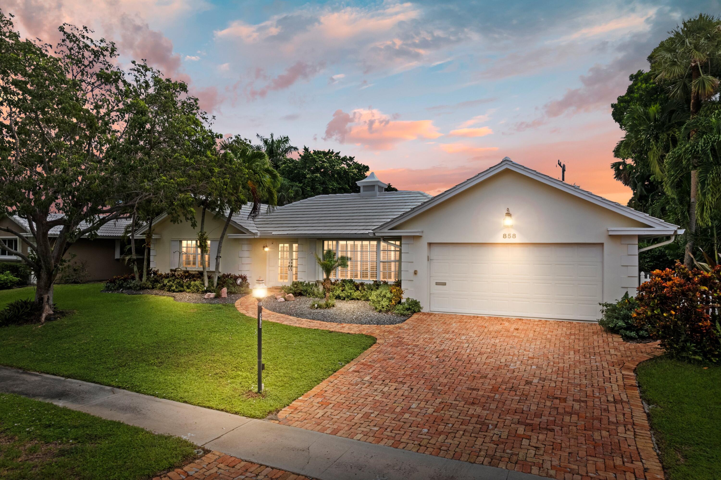858 Hickory Terrace Boca Raton, FL 33486 - Photo 27 of 43 a front view of house with yard and green space