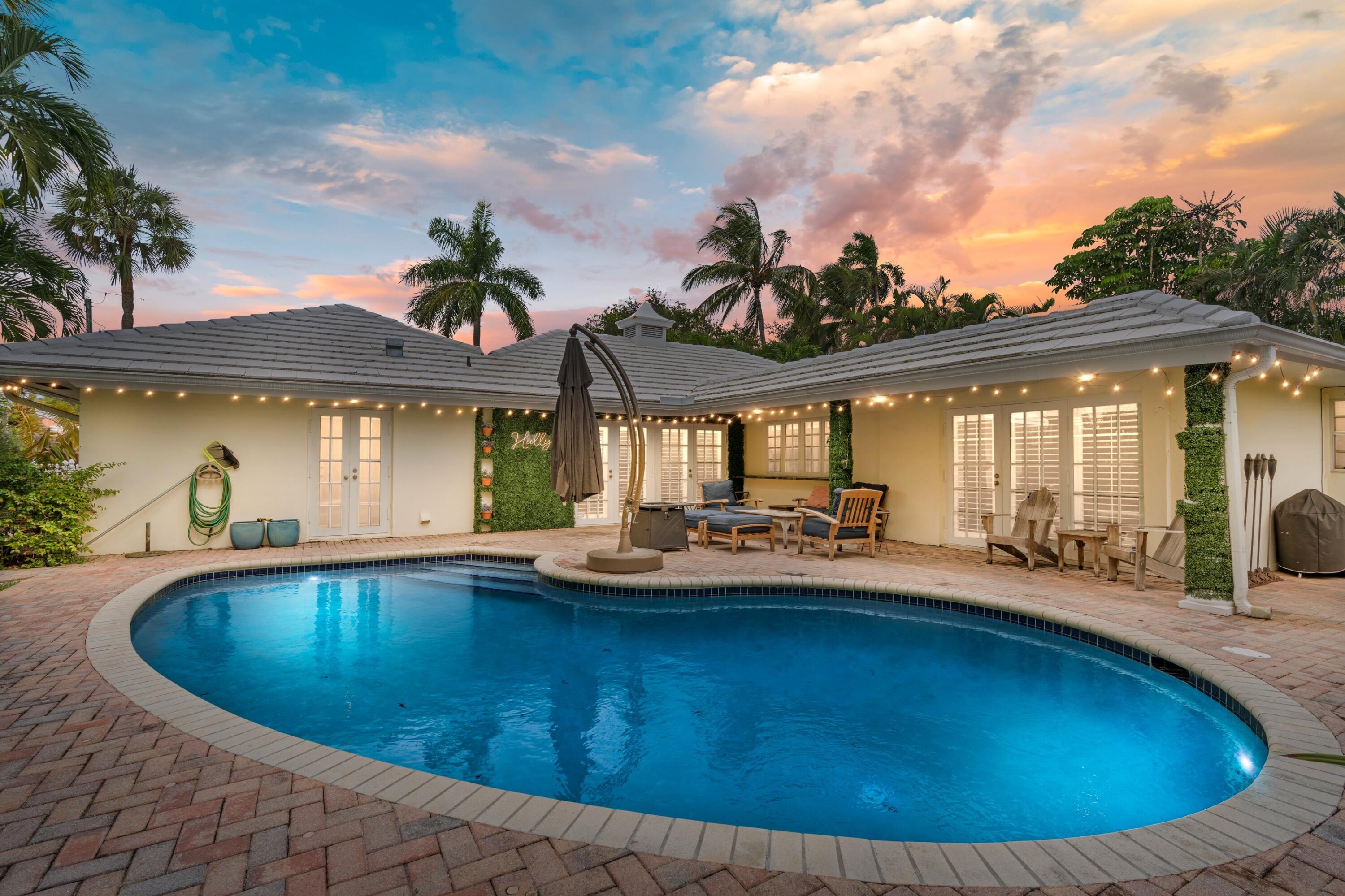 858 Hickory Terrace Boca Raton, FL 33486 - Photo 3 of 43 a view of a house with swimming pool and sitting area