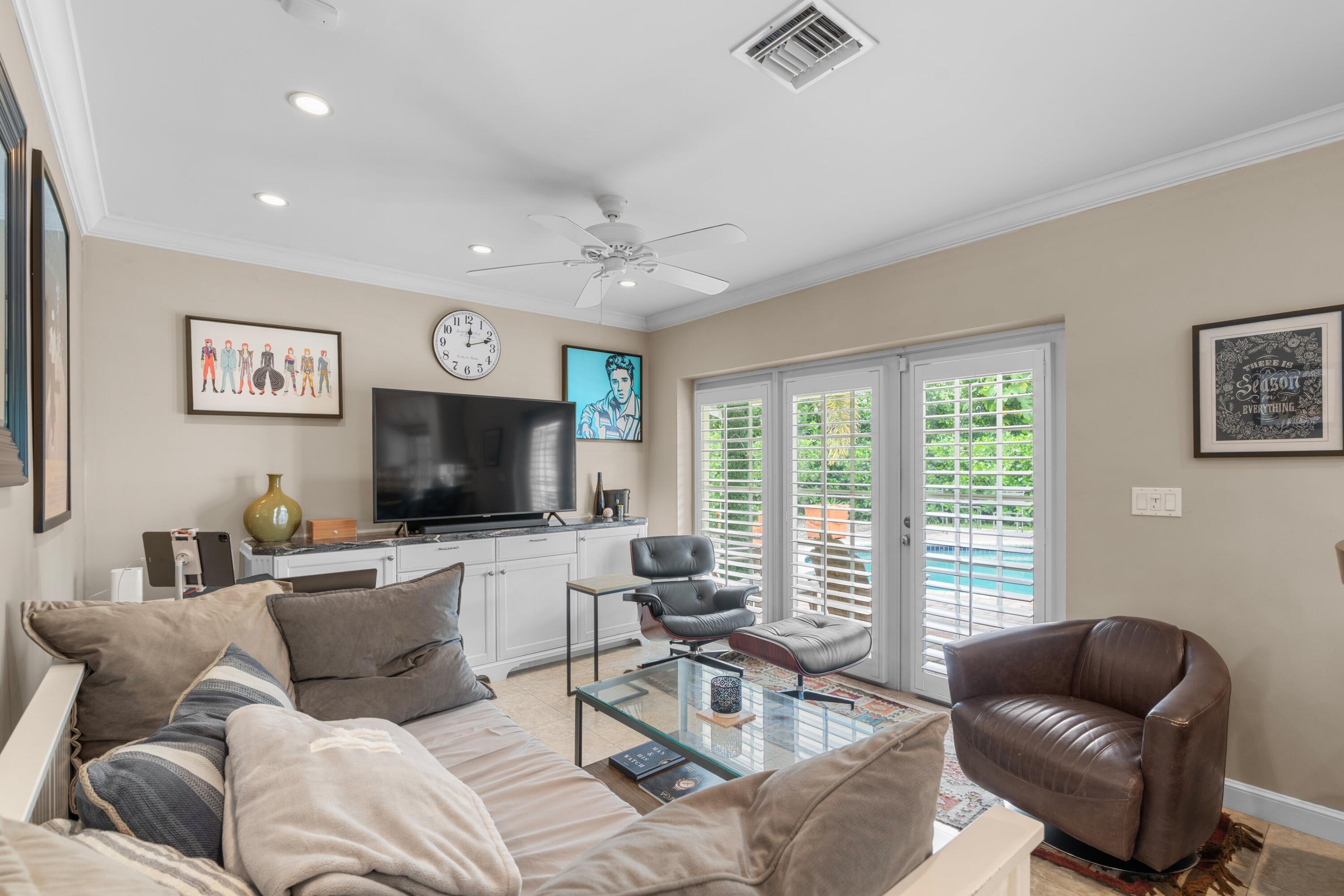 858 Hickory Terrace Boca Raton, FL 33486 - Photo 7 of 43 a living room with furniture and a flat screen tv