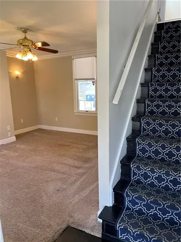 a view of an entryway with wooden floor