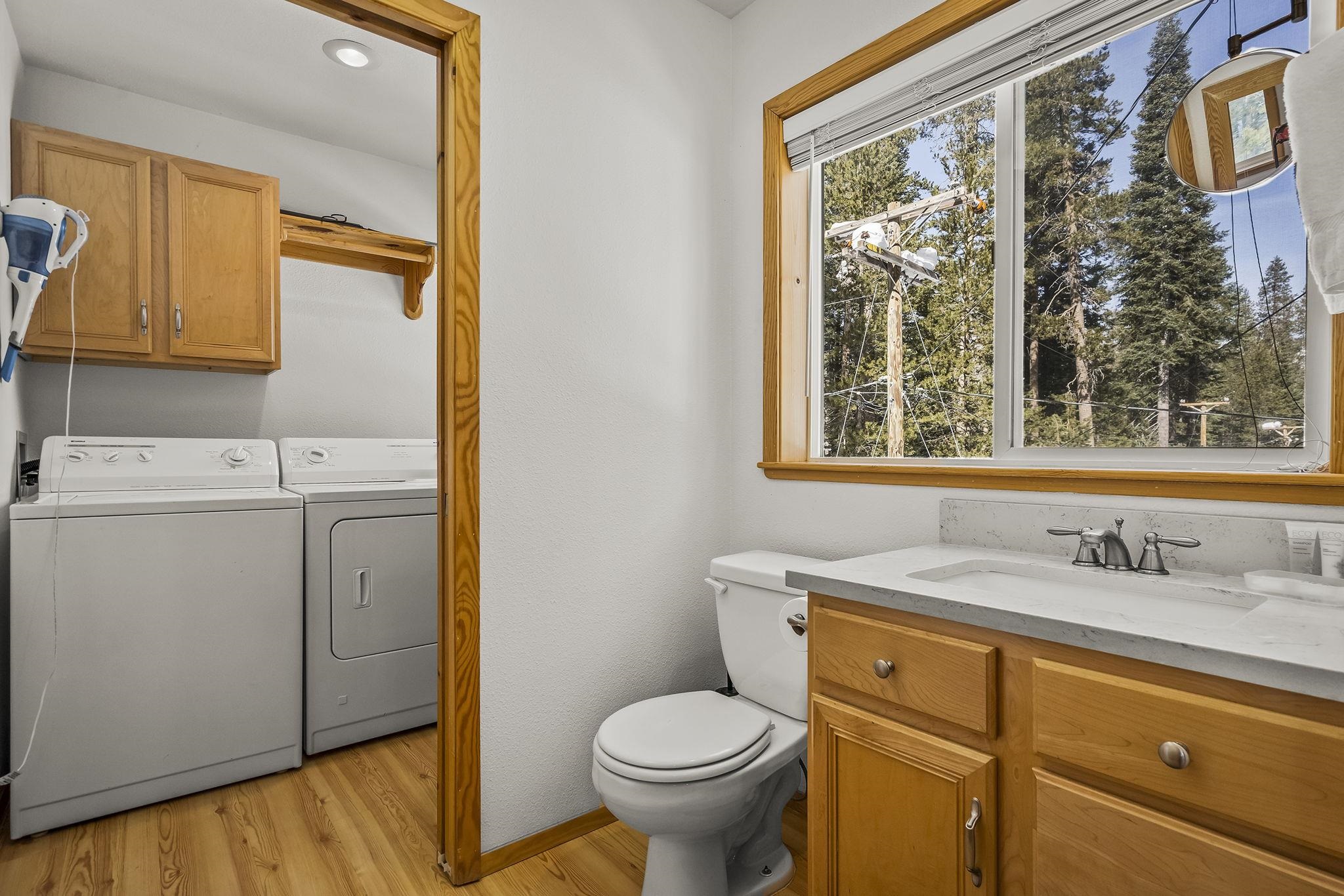 15591 Conifer Drive Truckee, CA 96161 - Photo 18 of 28 a bathroom with a sink toilet and window