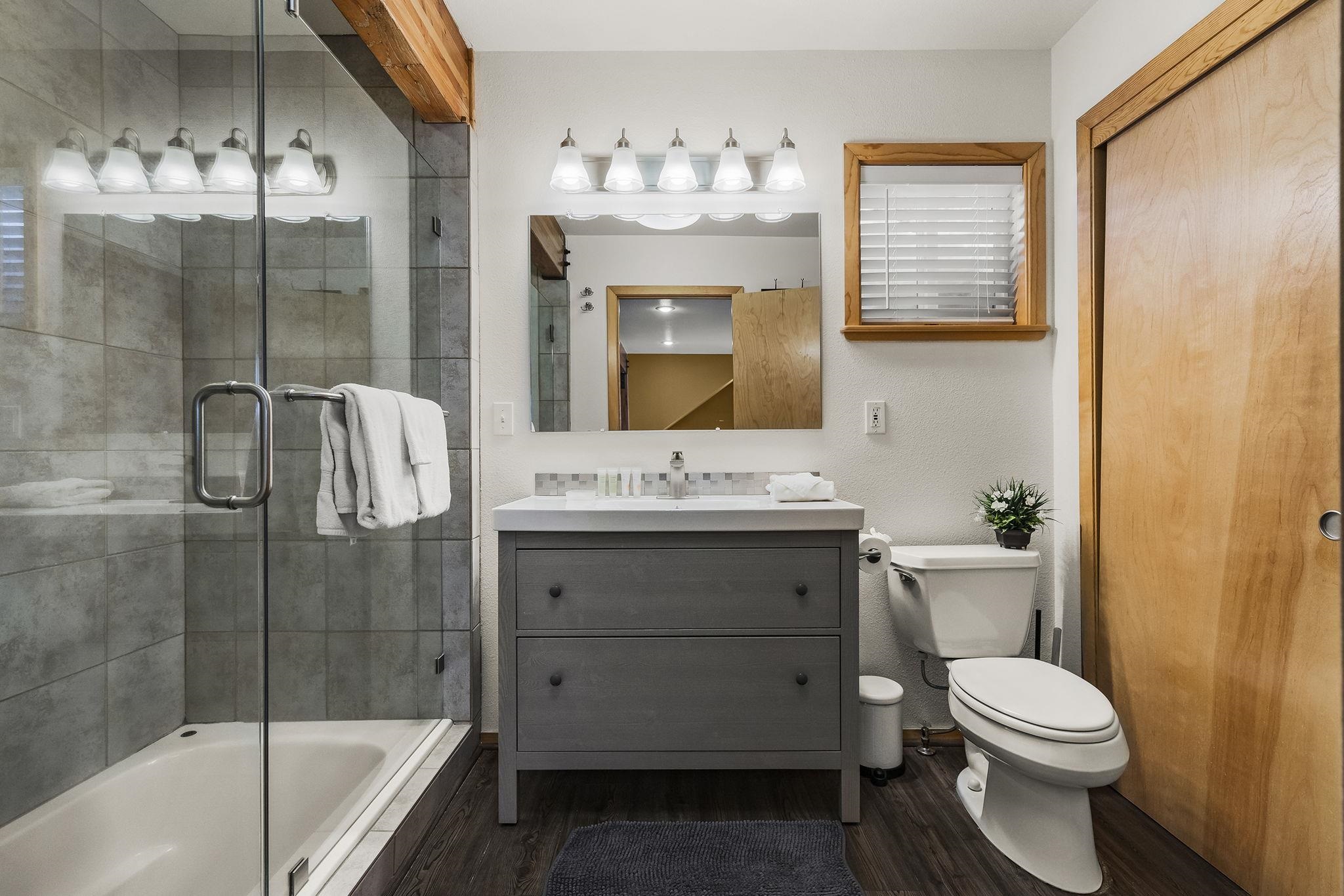 15591 Conifer Drive Truckee, CA 96161 - Photo 21 of 28 a bathroom with a sink a toilet and shower