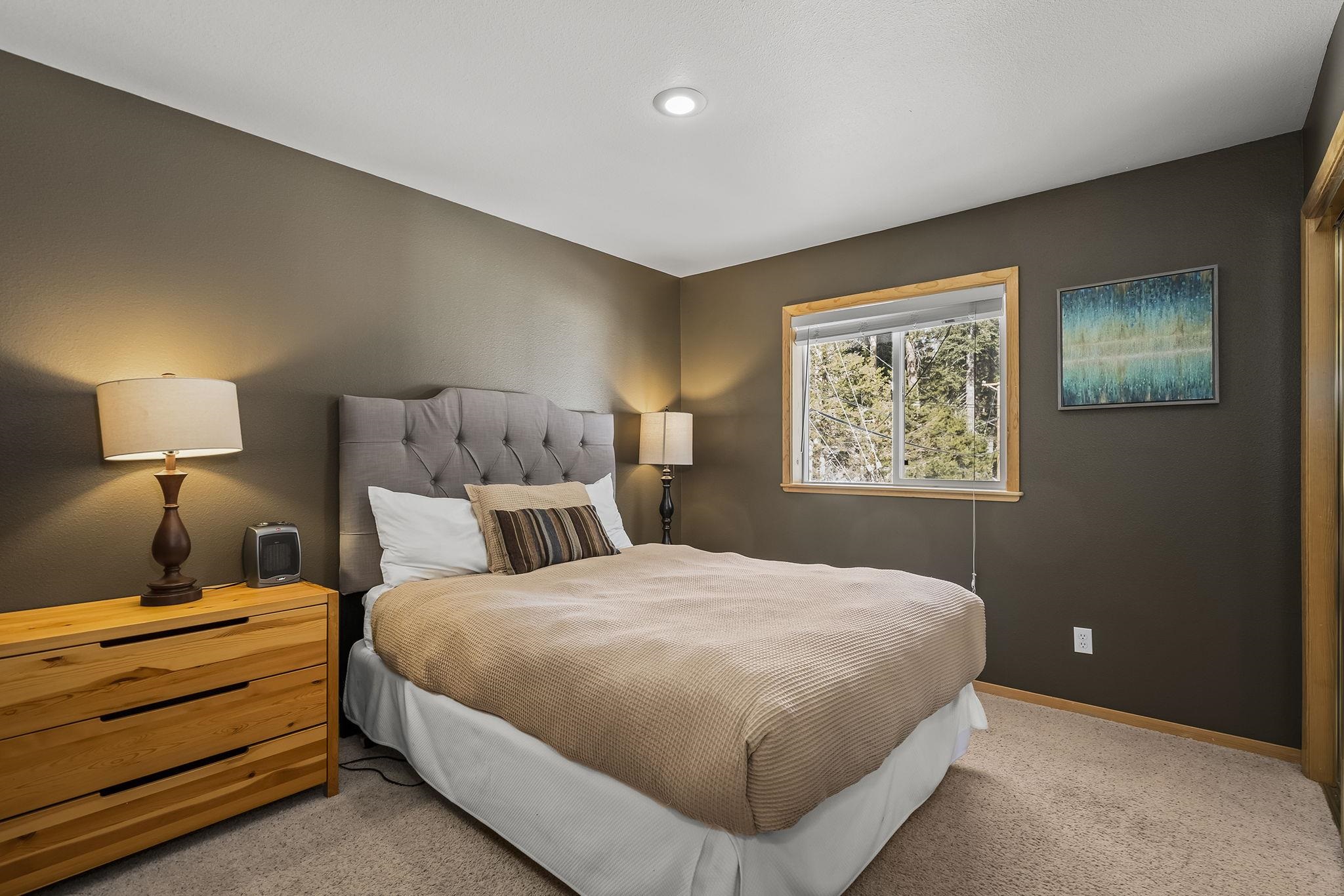 15591 Conifer Drive Truckee, CA 96161 - Photo 22 of 28 a bedroom with a bed and a night stand