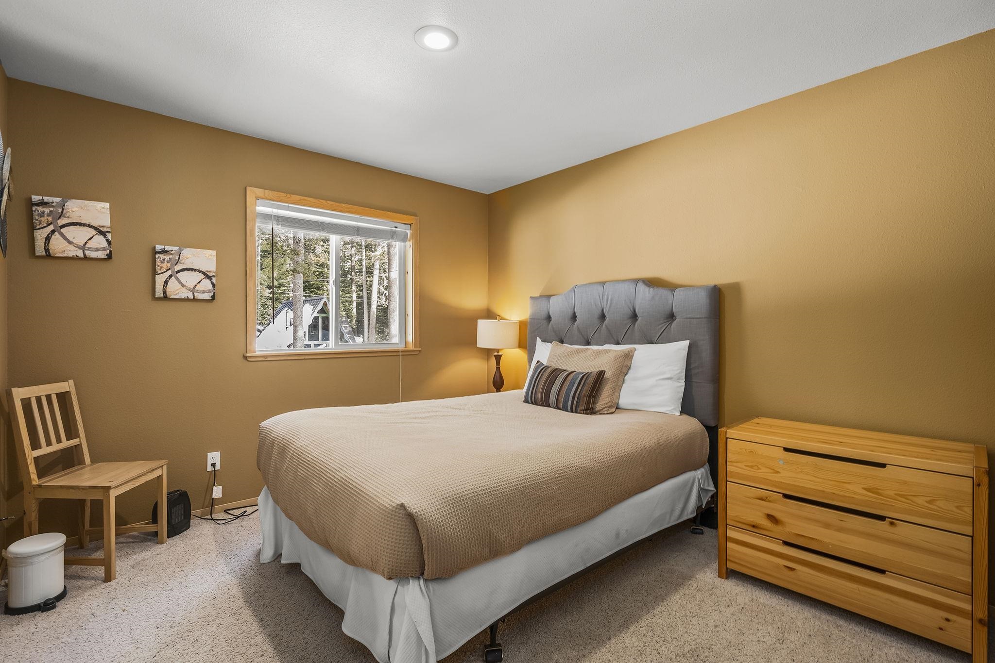 15591 Conifer Drive Truckee, CA 96161 - Photo 23 of 28 a bedroom with a bed and a window