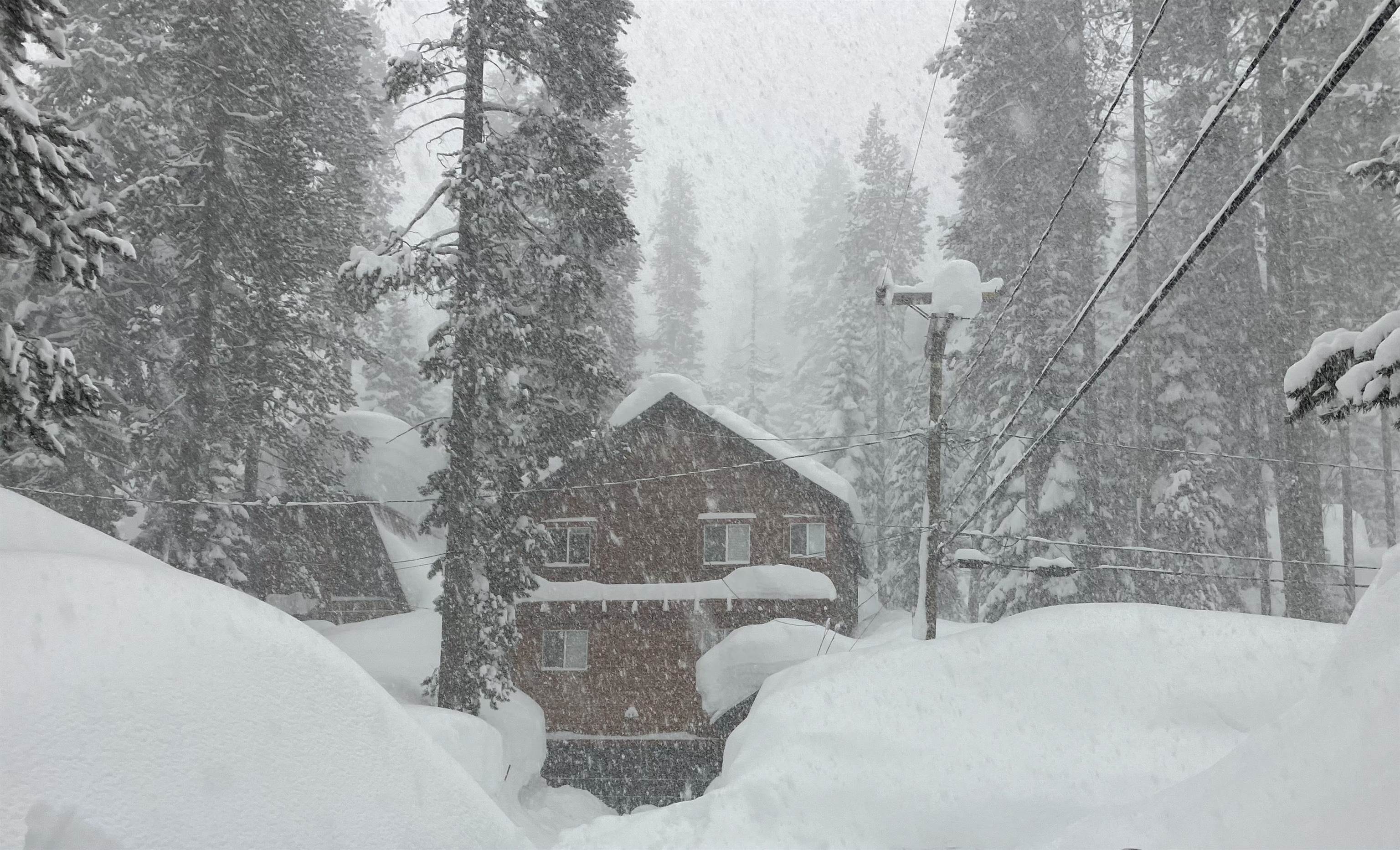 15591 Conifer Drive Truckee, CA 96161 - Photo 6 of 28 a view of a house with a snow in the yard