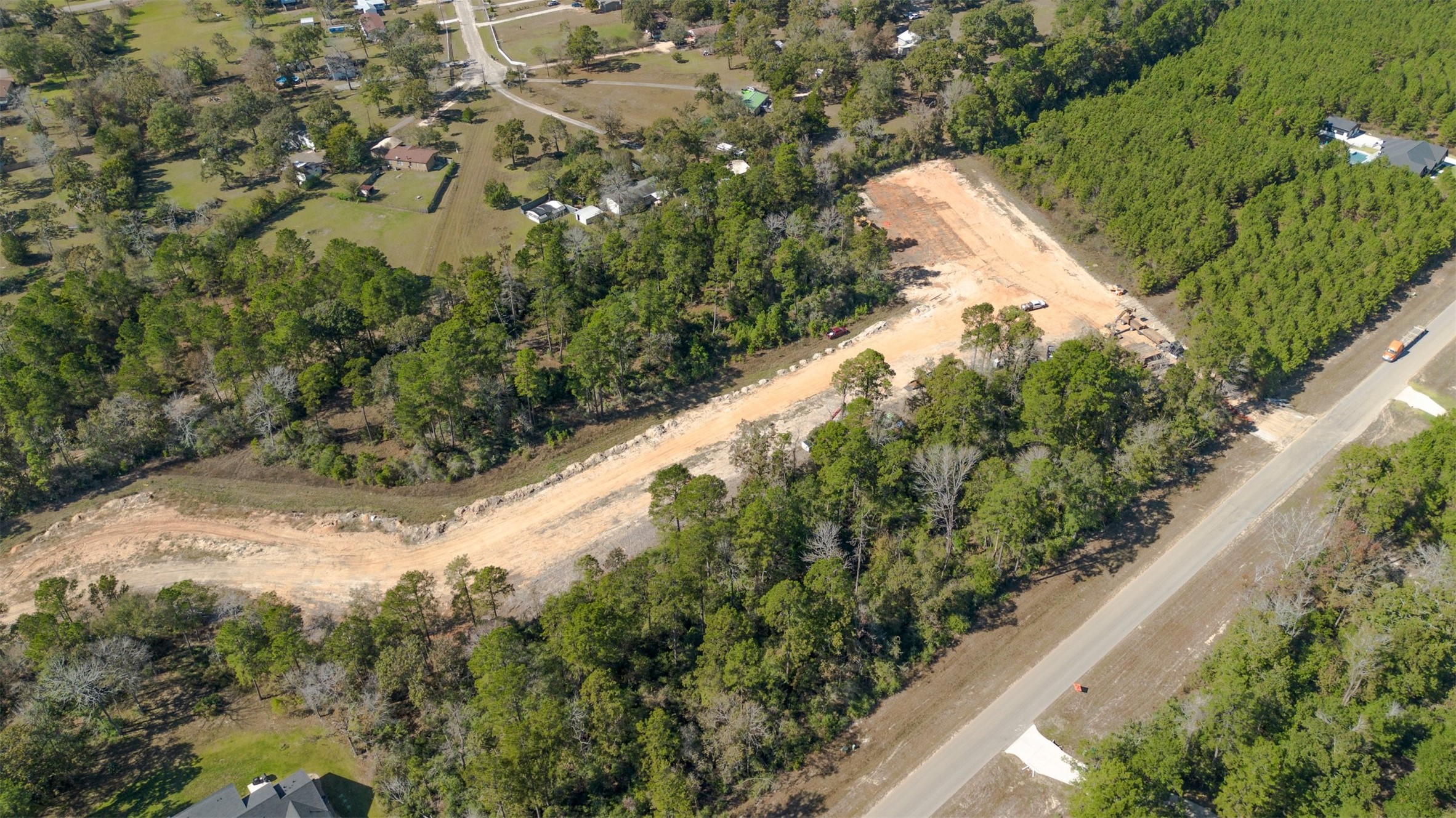 15645 Ridge Rock Road Willis, TX 77378 - Photo 6 of 15 a view of a yard with plants and a bench