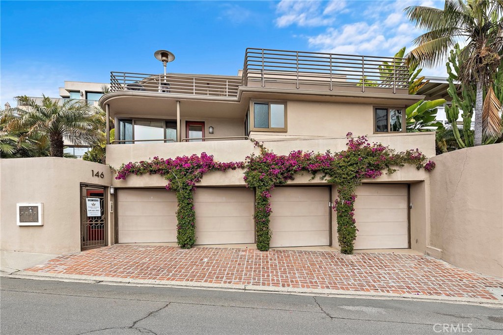 a front view of a house with a garage