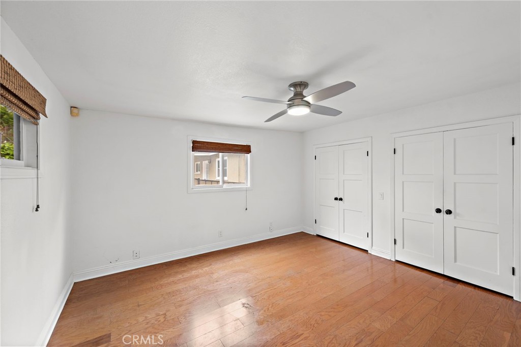 146 Cliff Drive, Unit C Laguna Beach, CA 92651 - Photo 15 of 21 a view of an empty room with a ceiling fan