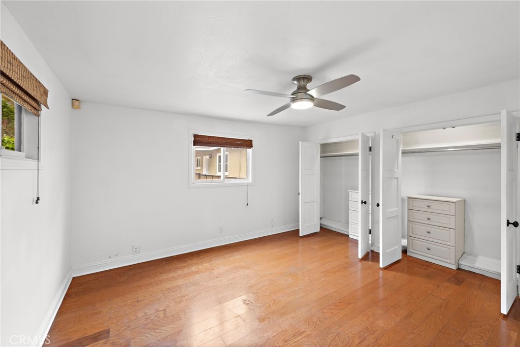 146 Cliff Drive, Unit C Laguna Beach, CA 92651 - Photo 17 of 21 an empty room with closet and a ceiling fan