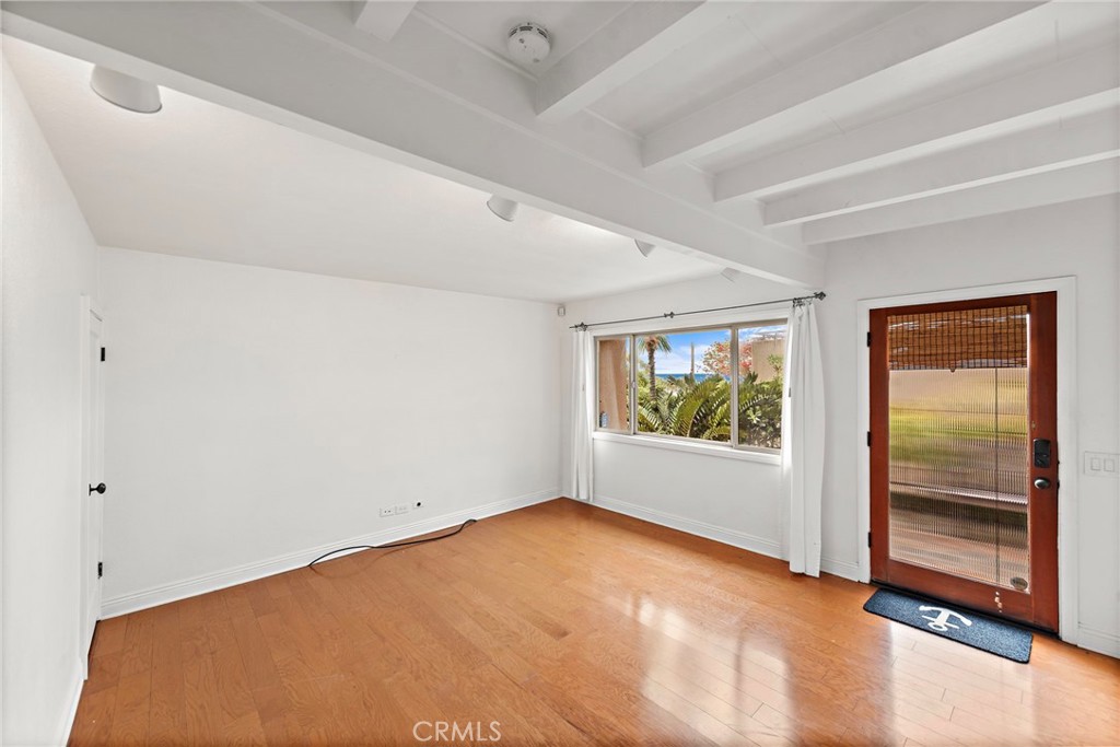 146 Cliff Drive, Unit C Laguna Beach, CA 92651 - Photo 9 of 21 an empty room with windows