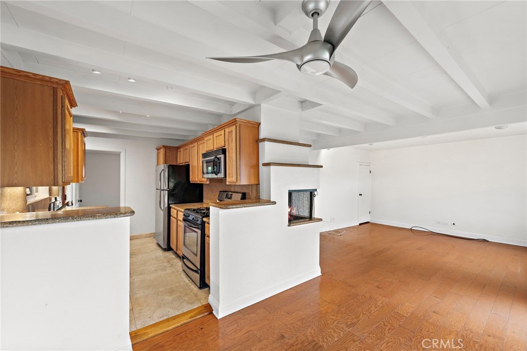 146 Cliff Drive, Unit C Laguna Beach, CA 92651 - Photo 10 of 21 a kitchen with a sink appliances and cabinets