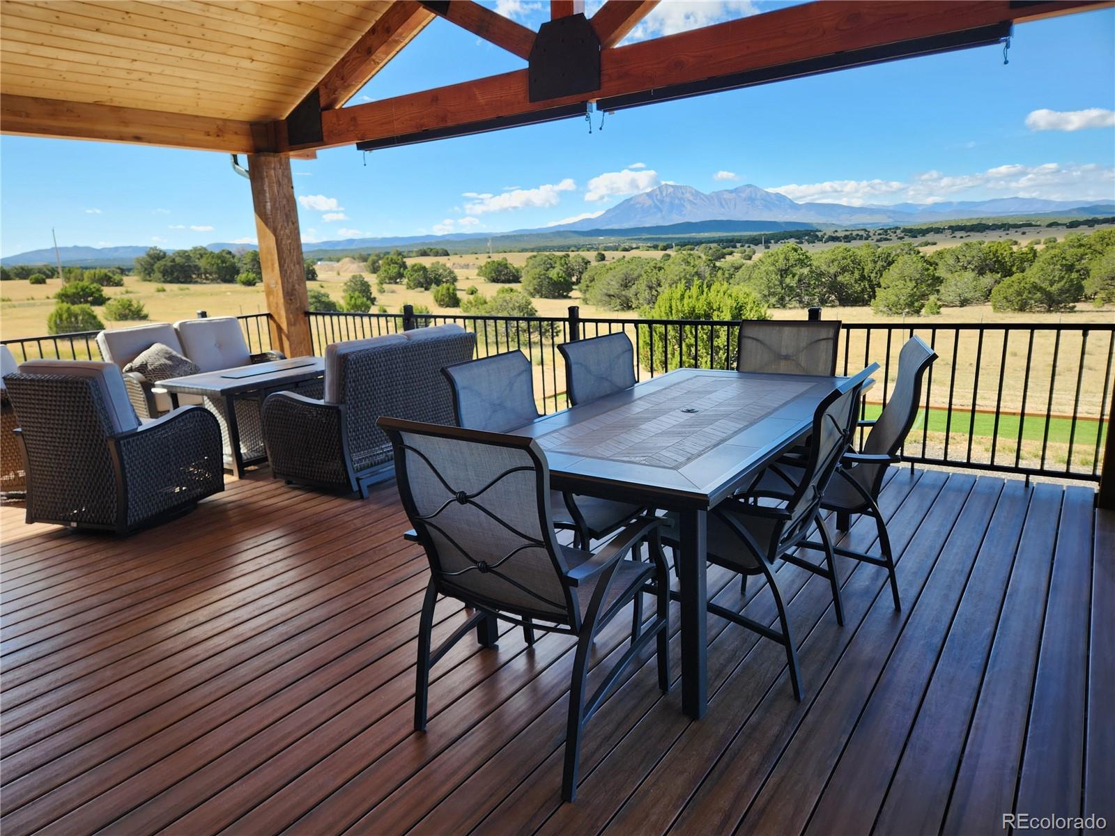 517 Trailsend Road Walsenburg, CO 81089 - Photo 11 of 33 a view of a balcony with furniture and wooden floor