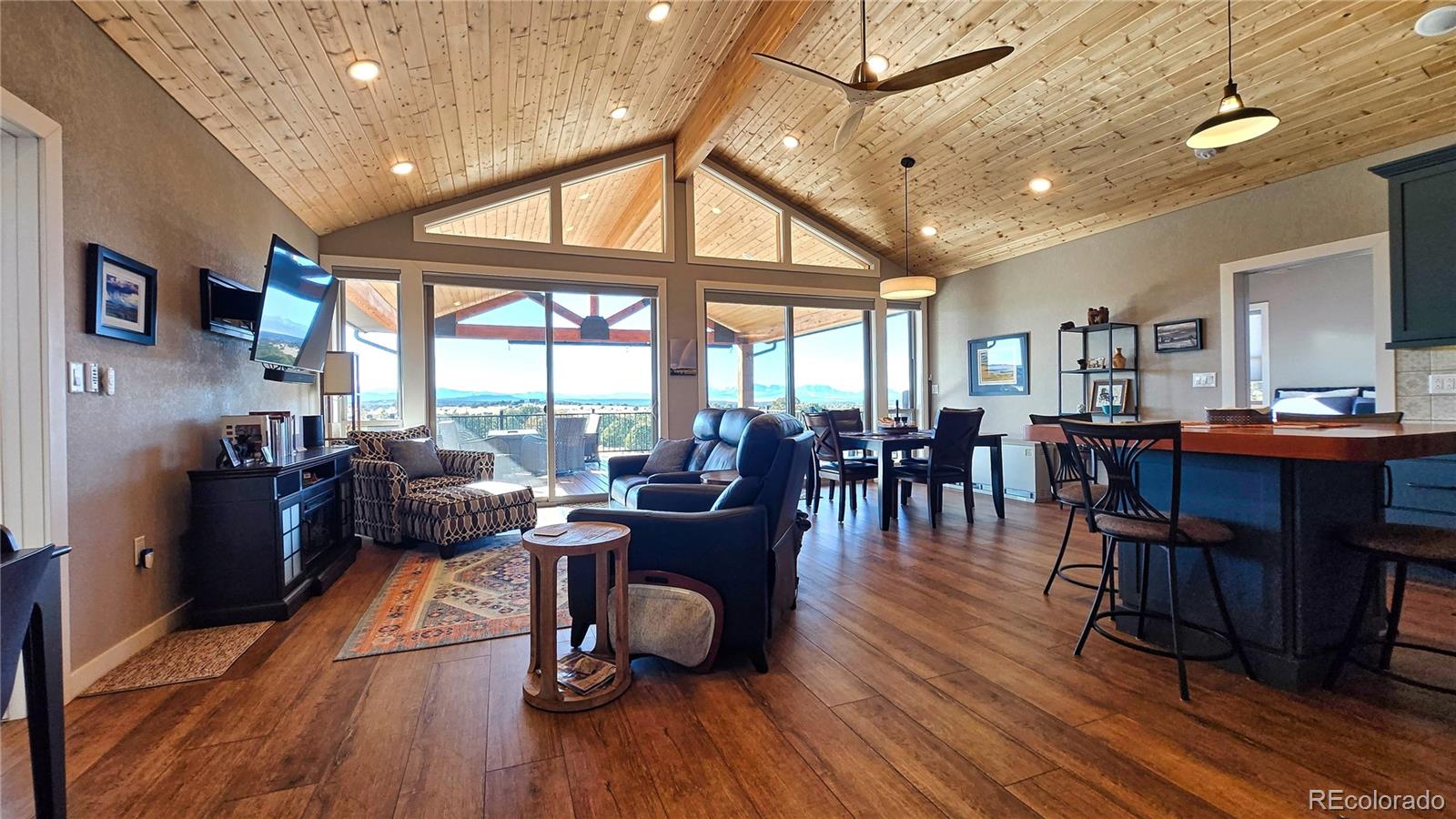 517 Trailsend Road Walsenburg, CO 81089 - Photo 13 of 33 a living room with furniture a wooden floor and next to a window