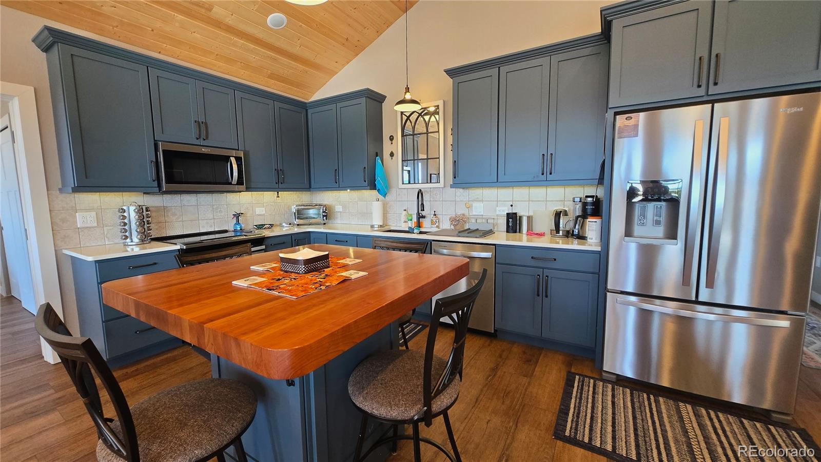 517 Trailsend Road Walsenburg, CO 81089 - Photo 18 of 33 a kitchen with stainless steel appliances granite countertop a sink refrigerator and microwave