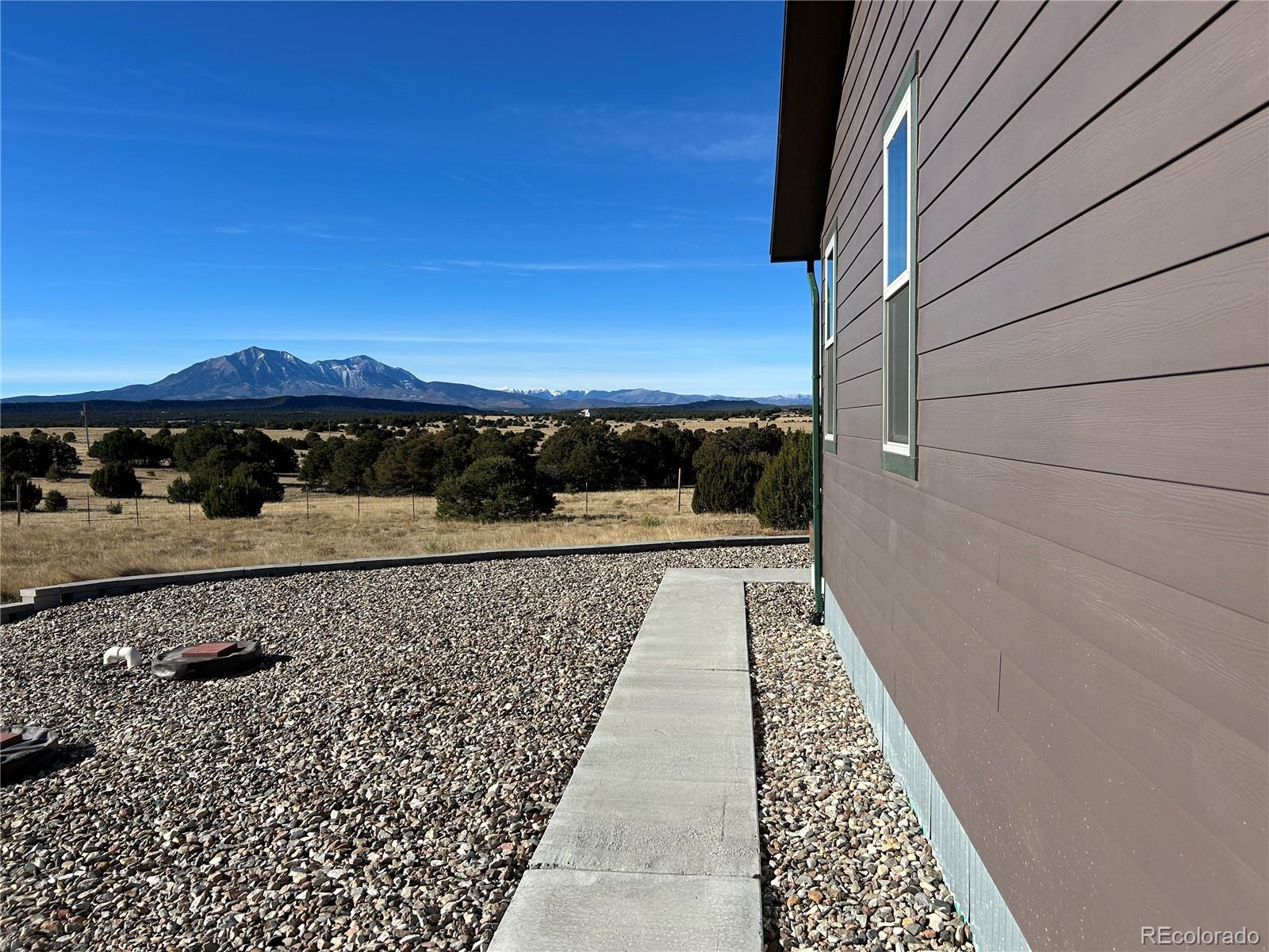 517 Trailsend Road Walsenburg, CO 81089 - Photo 19 of 33 a view of balcony with wooden floor and a yard