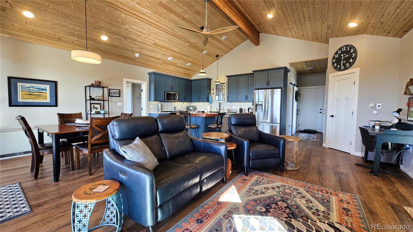 517 Trailsend Road Walsenburg, CO 81089 - Photo 23 of 33 a living room with furniture a refrigerator and kitchen view