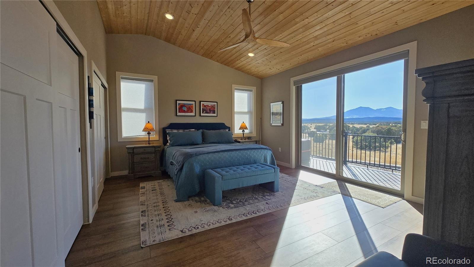 517 Trailsend Road Walsenburg, CO 81089 - Photo 25 of 33 a bedroom with a large bed and a balcony view