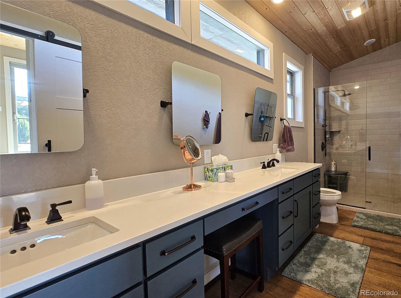 517 Trailsend Road Walsenburg, CO 81089 - Photo 26 of 33 a bathroom with a double vanity sink mirror double and shower