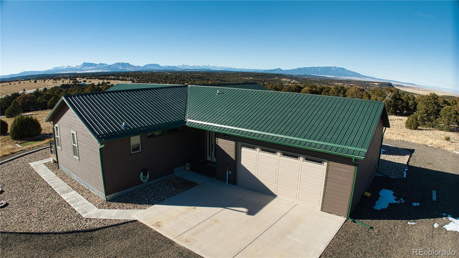 517 Trailsend Road Walsenburg, CO 81089 - Photo 9 of 33 a view of roof deck with two couches and city view