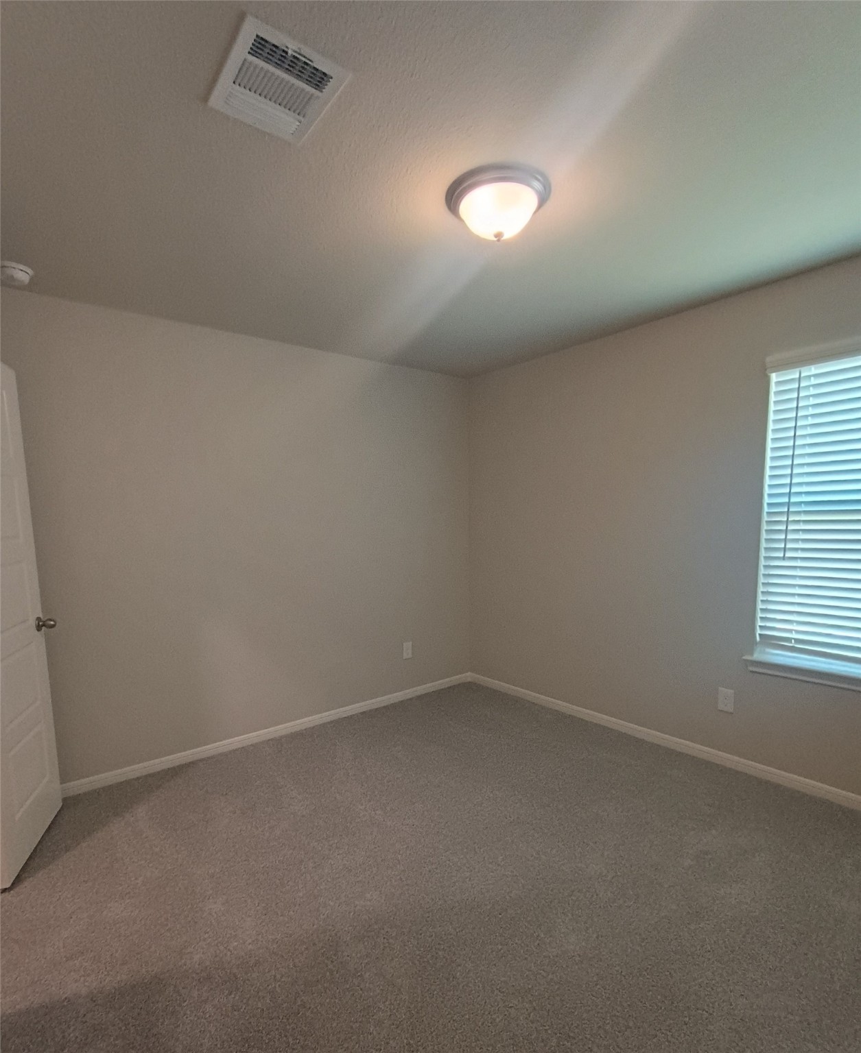 26414 Cooperstown Way Splendora, TX 77372 - Photo 12 of 23 an empty room with a window