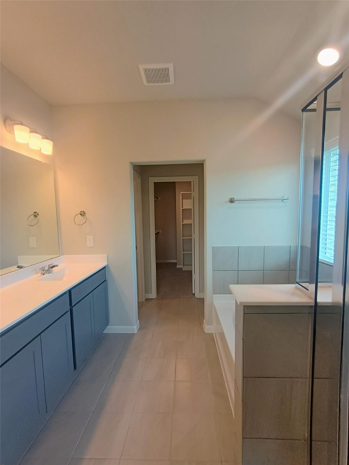 26414 Cooperstown Way Splendora, TX 77372 - Photo 15 of 23 a large bathroom with a sink and mirror