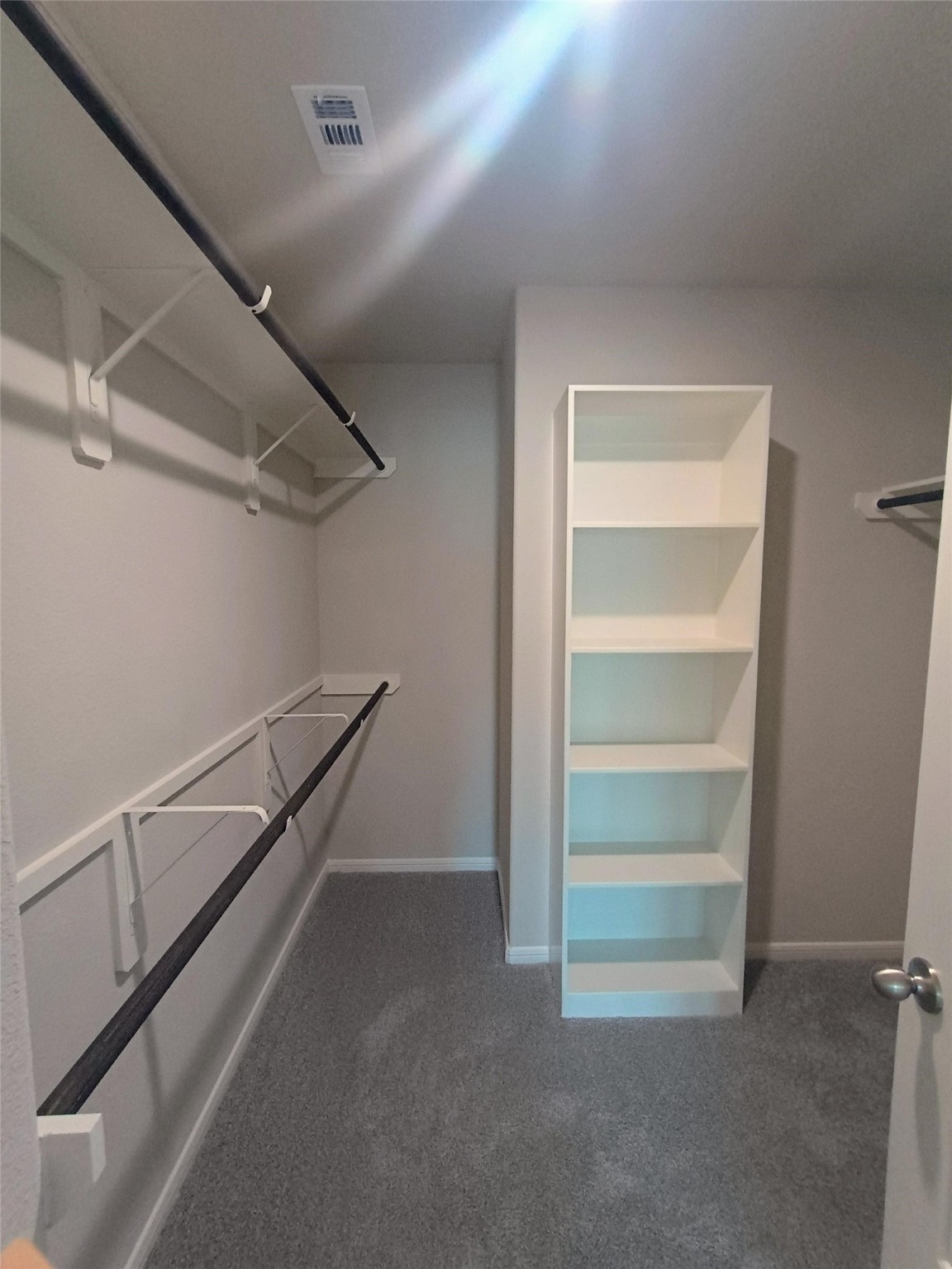 26414 Cooperstown Way Splendora, TX 77372 - Photo 17 of 23 a view of storage and utility room with racks on the wall