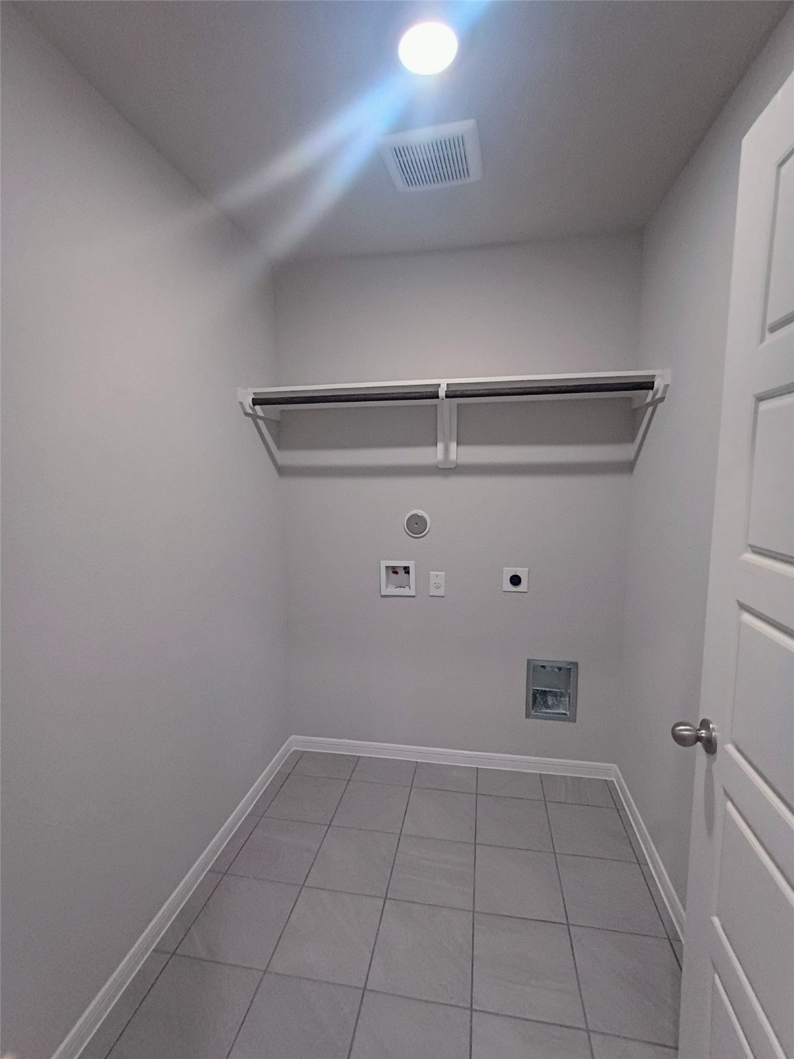 26414 Cooperstown Way Splendora, TX 77372 - Photo 8 of 23 a view of a storage & utility room with racks on the wall