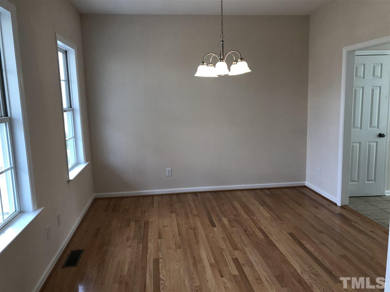 3220 La Costa Way Raleigh, NC 27610 - Photo 3 of 16 wooden floor in an empty room with a window