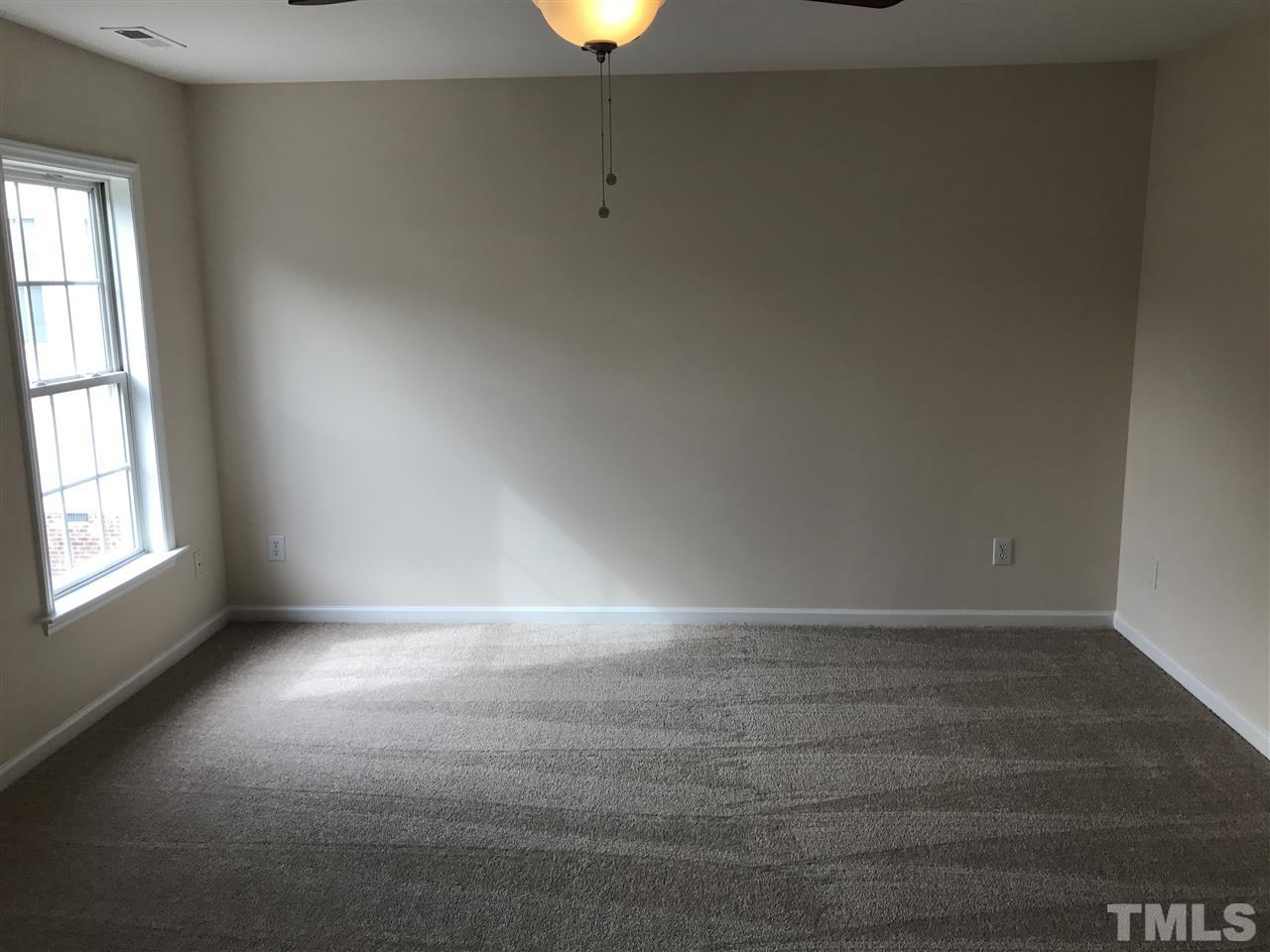 3220 La Costa Way Raleigh, NC 27610 - Photo 8 of 16 an empty room with a empty space and window