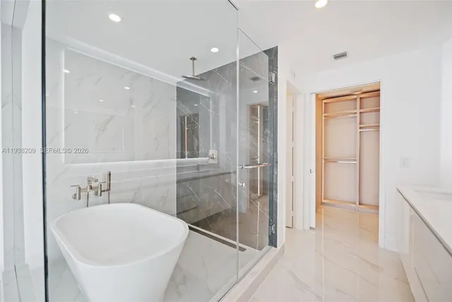 a bathroom with a bathtub and a sink