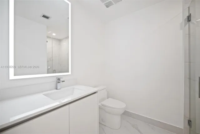 a bathroom with a sink and a toilet