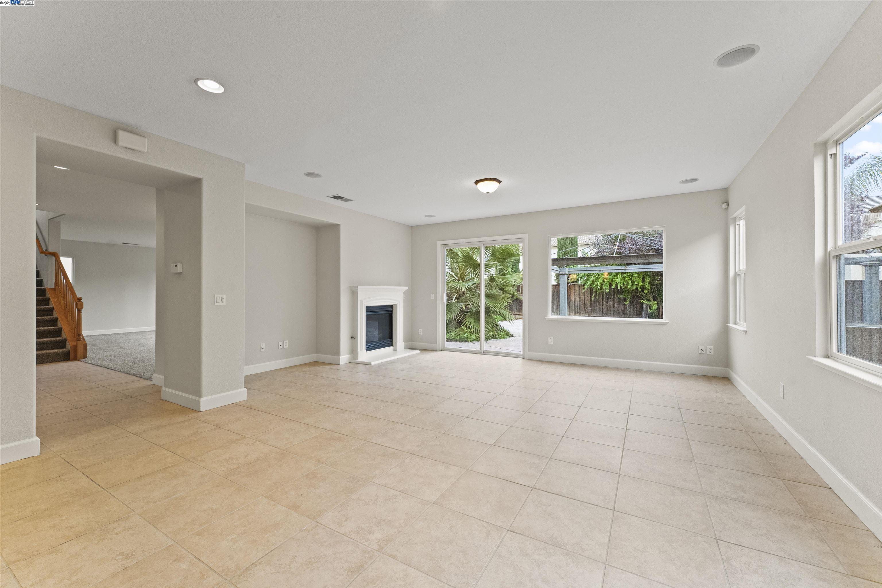 204 Daylilly Lane Patterson, CA 95363 - Photo 11 of 52 a view of an empty room with a window