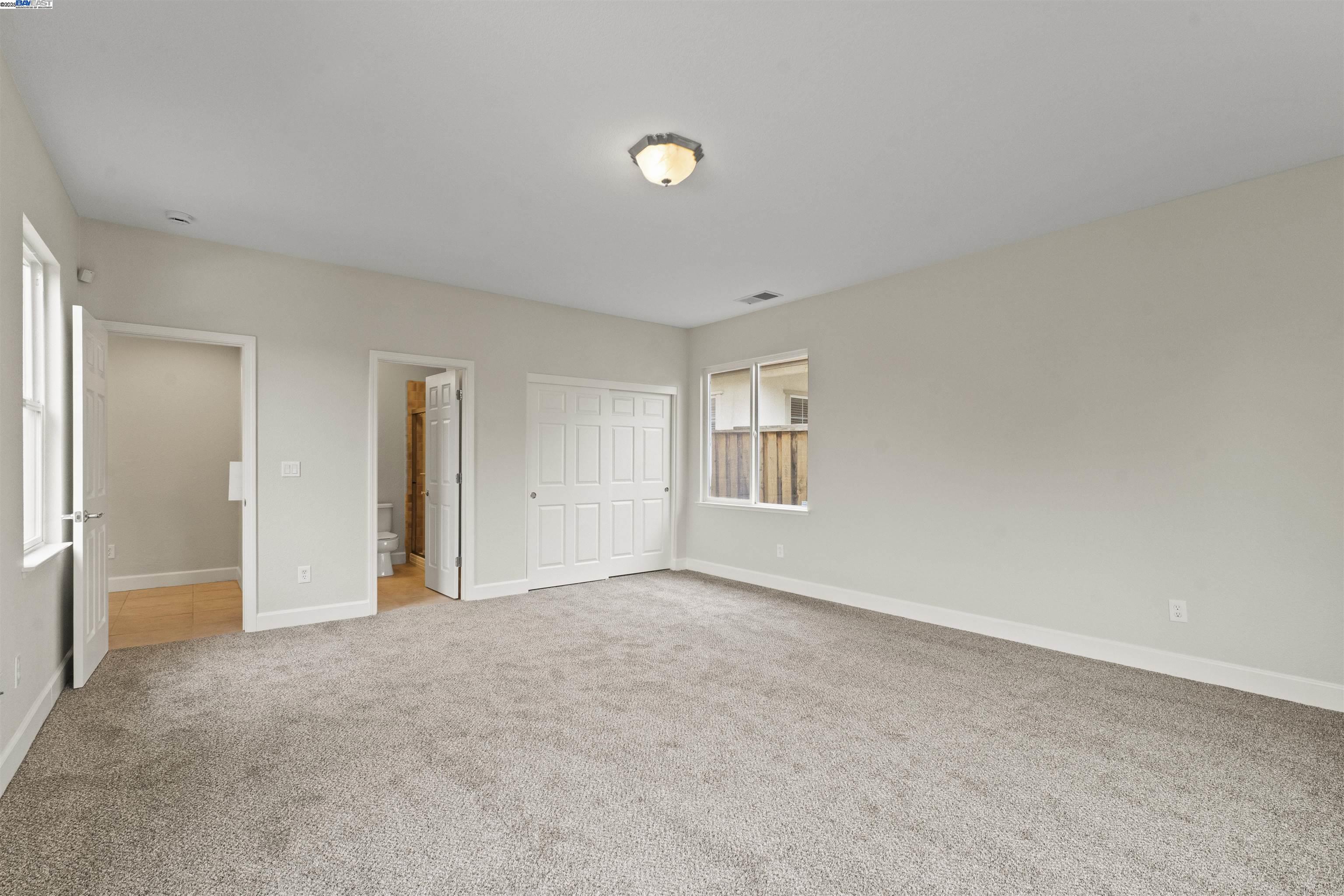 204 Daylilly Lane Patterson, CA 95363 - Photo 20 of 52 a view of an empty room with a window