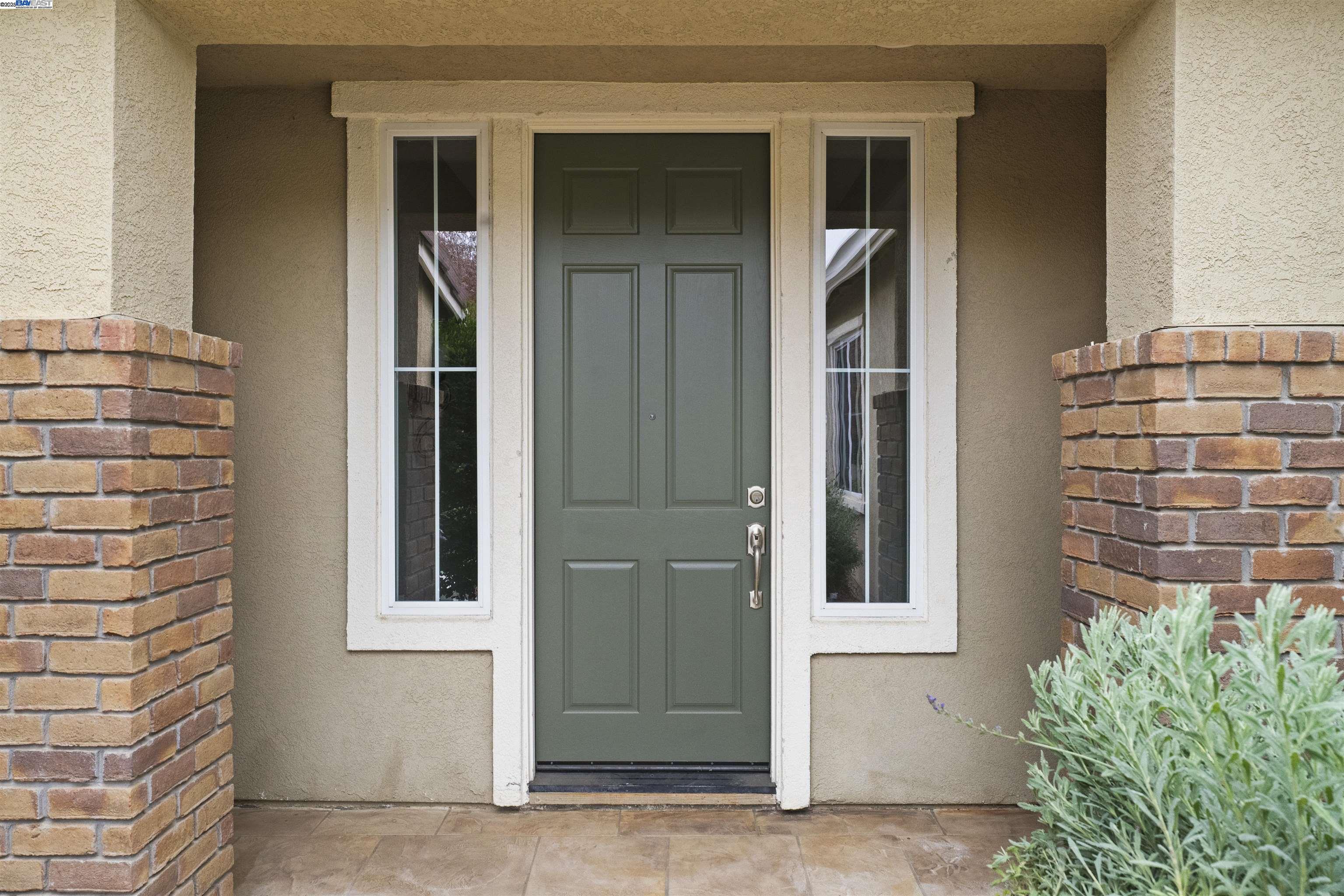 204 Daylilly Lane Patterson, CA 95363 - Photo 3 of 52 a view of front door of house
