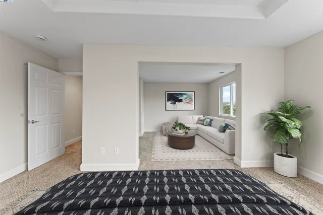 a large white bed in a white room